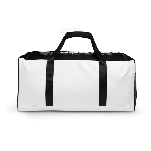 Sideview of a black and white sports bag with a smiley and the words 'be cool do crime' printed on it's top in white capital letters, the print is barely visible due to the perspective, black handle and straps