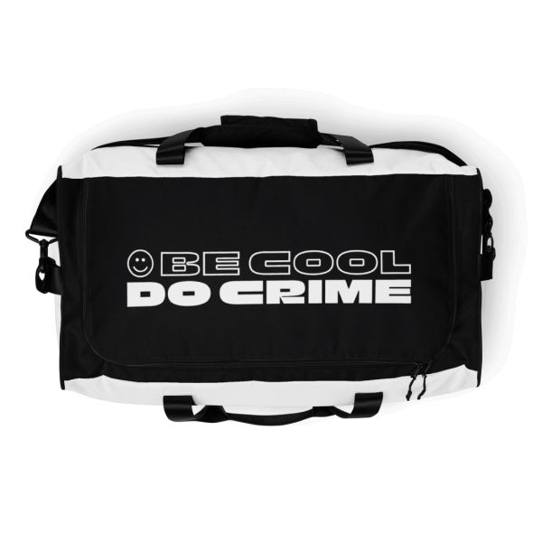 Black and white sports bag with a smiley and the words 'be cool do crime' printed on it's top in white capital letters, the smiley and the first two words are outlines, while the last two words are filled