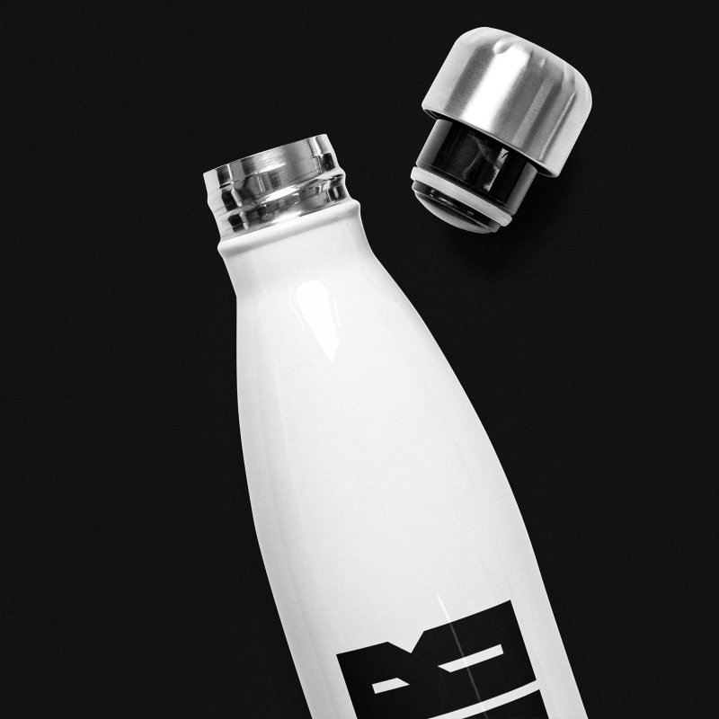 Upper half of an antifascist white bottle with an 'ACAB' print on it, which stands for 'All cops Are Bactards', brushed steel lid is open, black background