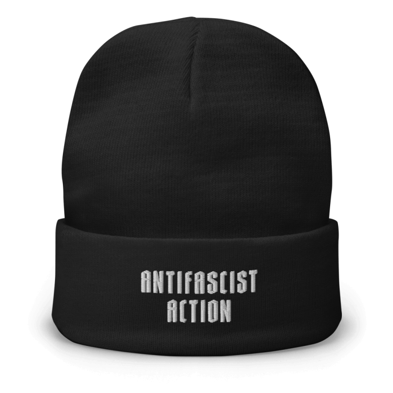 A woolly hat with an embroidery in the lower front, saying 'Antifascist Action' in capital letters