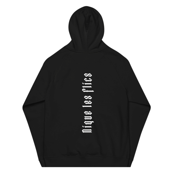 Back of a black hoodie, that has the letters 'Nique les flics' printed on, in white letters turned 90 degrees anticlockwise, which means 'fuck the cops' in english